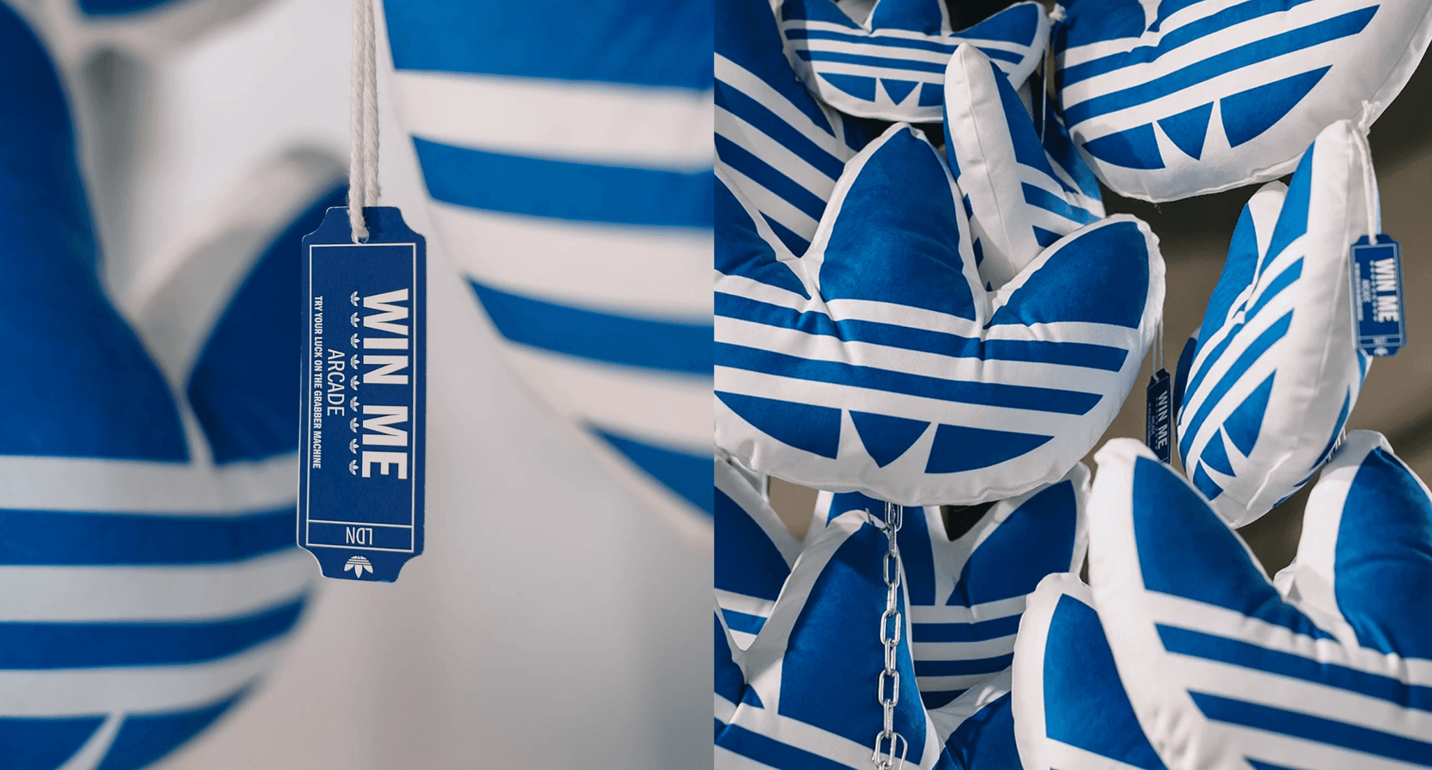 A close-up collection of blue and white plush pillows shaped like the Adidas trefoil logo.