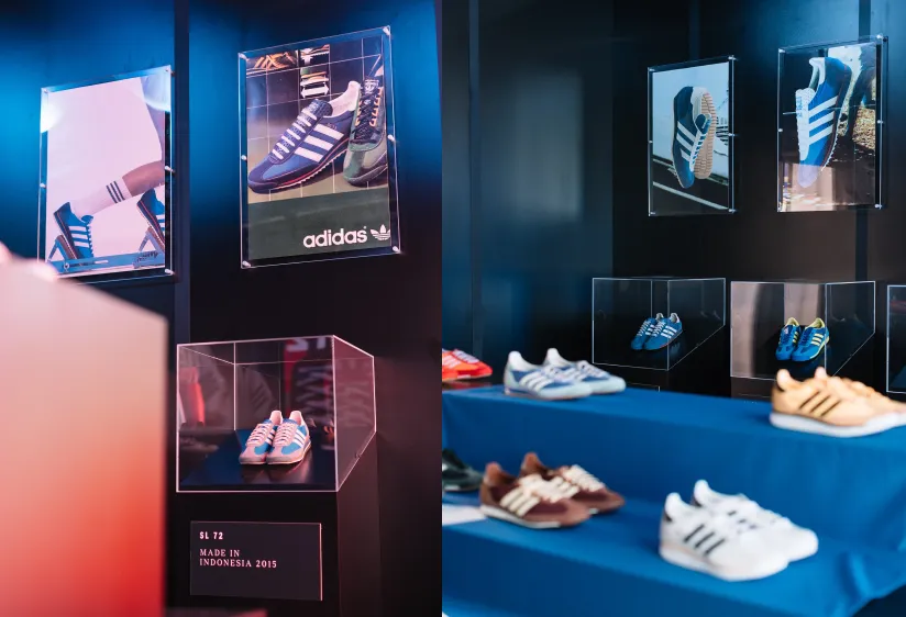 Illuminated museum-style display cases and blue shelves showcasing various vintage and modern Adidas SL 72 sneakers.