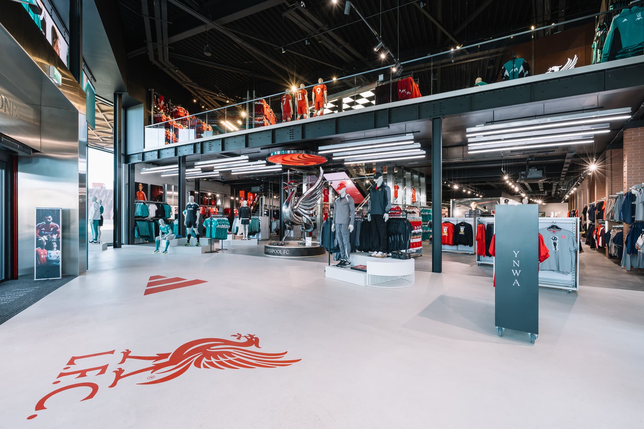 retail space with mannequins, and clothing racks.